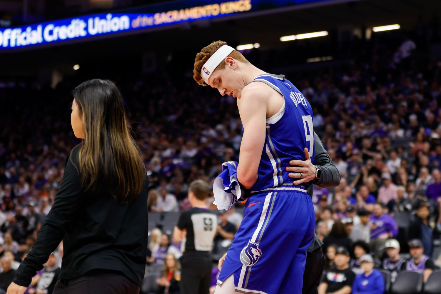 Mar 18, 2024; Sacramento, California, USA; Sacramento Kings guard Kevin Huerter (9) suffers an injury during the first quarter against the Memphis Grizzlies at Golden 1 Center. Mandatory Credit: Sergio Estrada-USA TODAY Sports